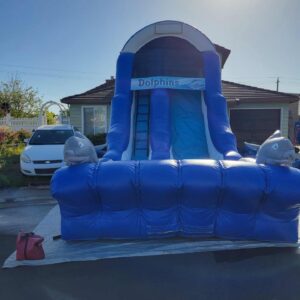 A large blue inflatable water slide set up outdoors.
